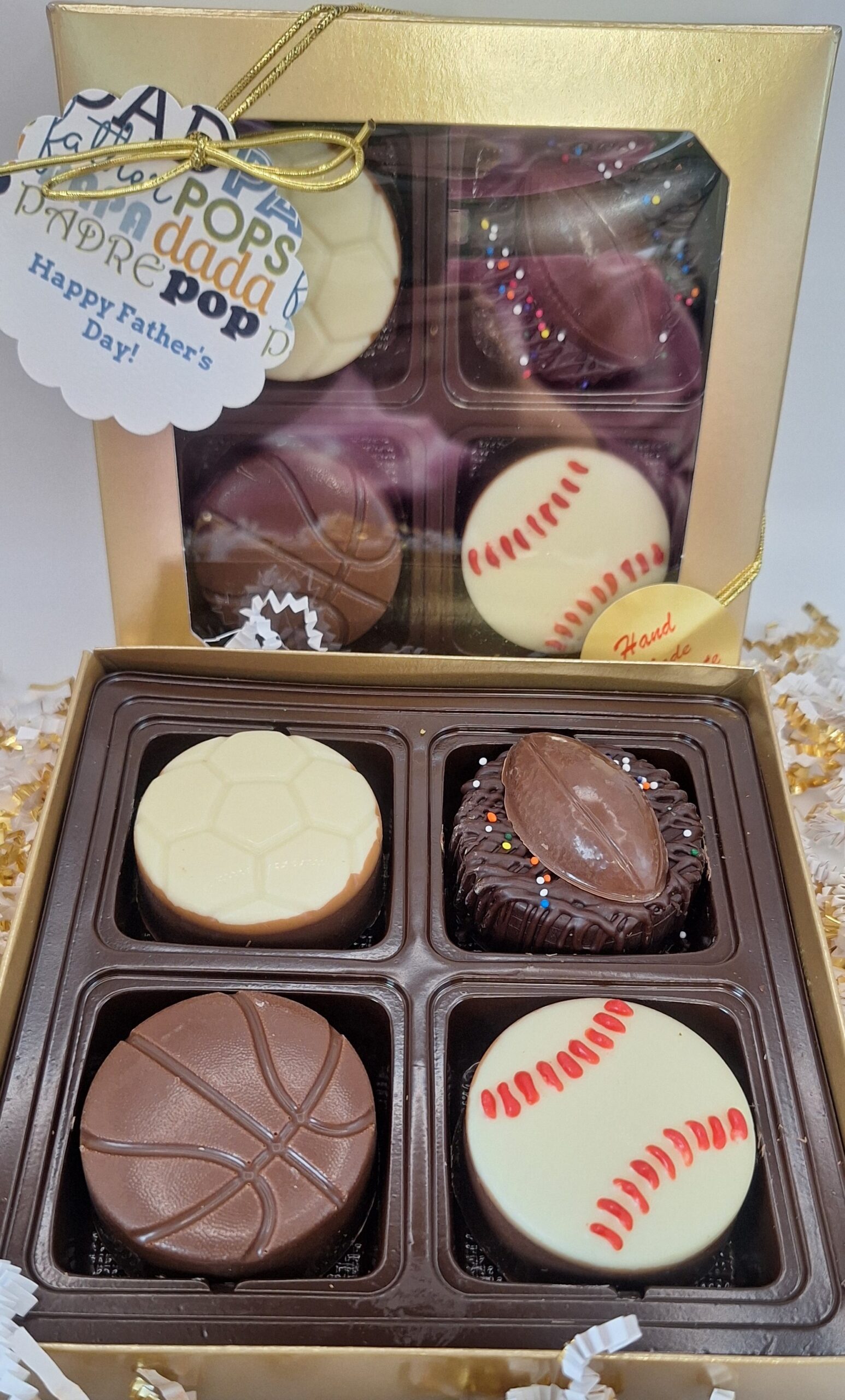 Four chocolate covered oreos decorated in sports themes and ready to gift