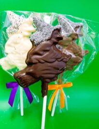 Handmade Gourmet Chocolate Witch Lollipops with a sparkly hat.
