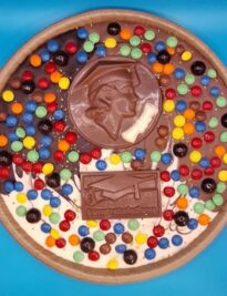 Chocolate Pizza with candy toppings and a Chocolate Graduation Coin