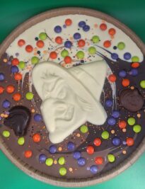 Chocolate pizza with Halloween chocolate decorations