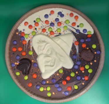 Chocolate pizza with Halloween chocolate decorations