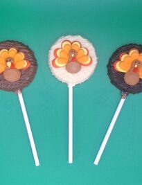 Round chocolate pop with a turkey sugar decal in the center