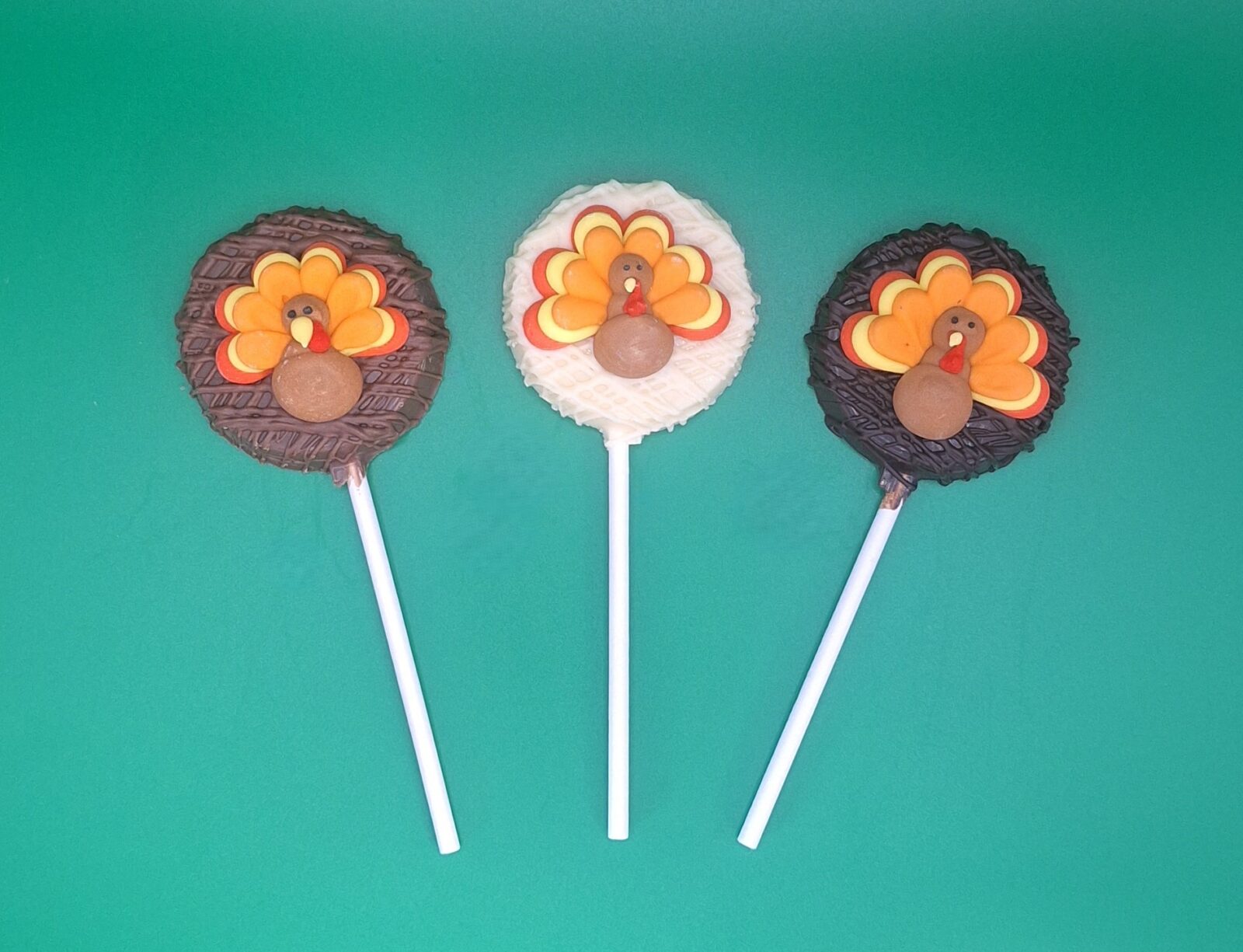 Round chocolate pop with a turkey sugar decal in the center