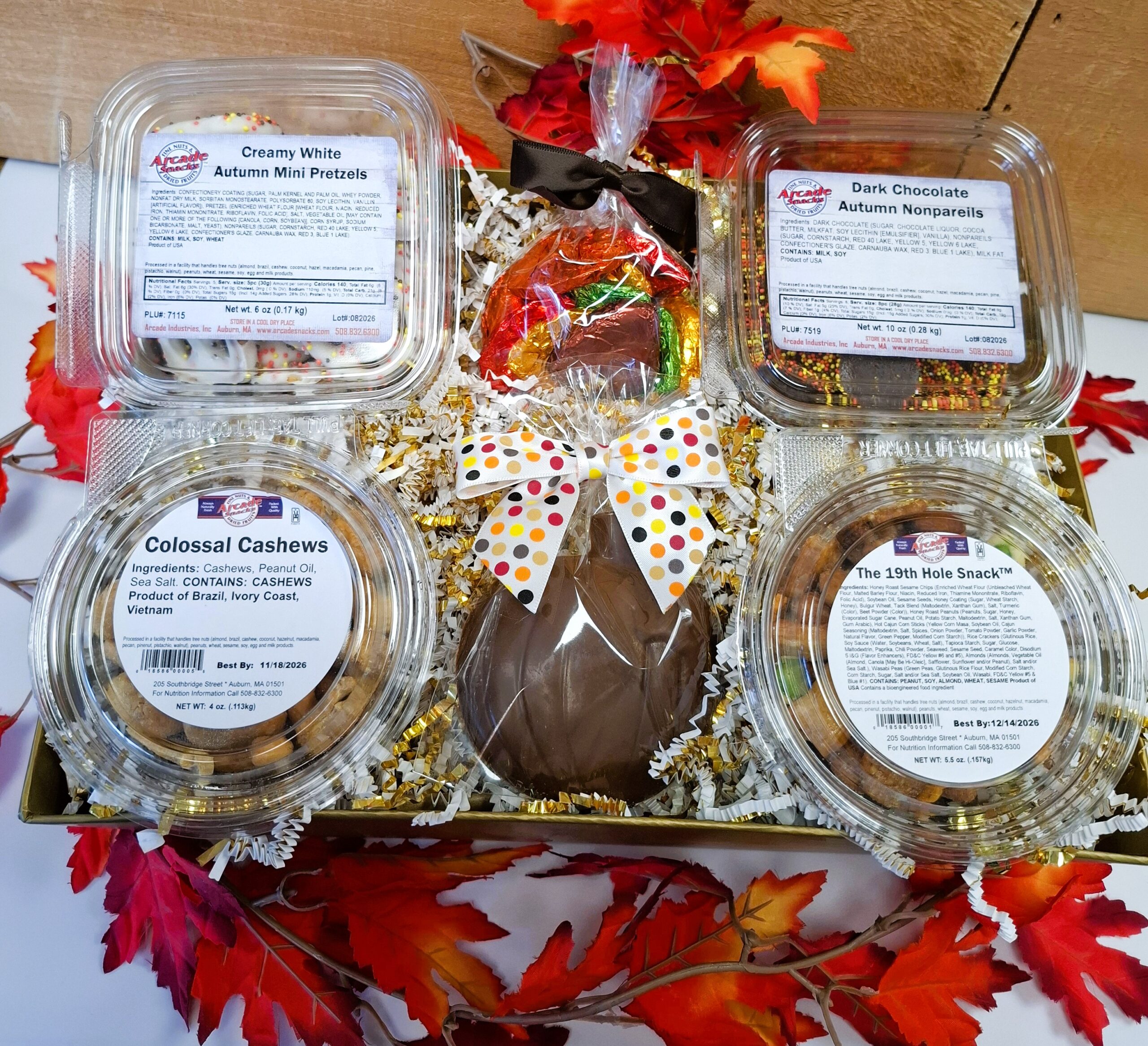 Savor the Flavors of Fall Gift Basket featuring gourmet autumn chocolates, white chocolate pretzels, freshly roasted colossal cashews, 19th Hole Snack Mix, and a handmade milk chocolate pumpkin.