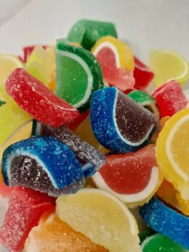 Mini fruit slices in green, yellow, red, blue, and pink