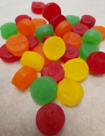Red, yellow, green and orange fruit juju coins.