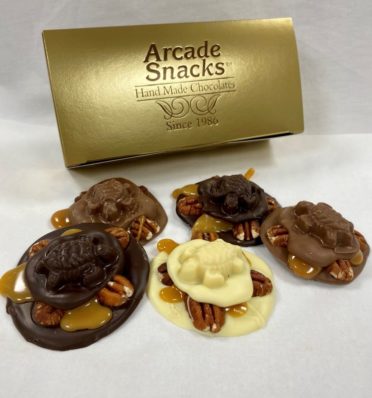 Assorted Chocolate Turtles in milk, dark, and white chocolate with gold gift box.