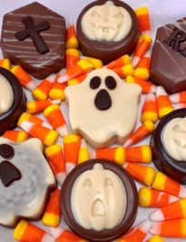 Single Chocolate Covered Oreo® Halloween Ghost closed with a satin bow.