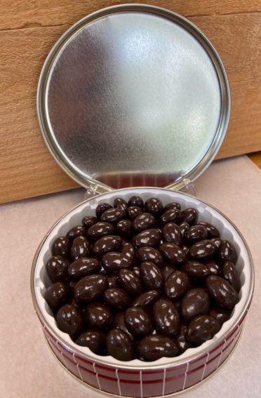 An open tin of Sugar Free Dark Chocolate Almonds