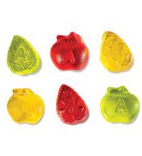 Red, yellow and green gummies shaped like apples and leaves