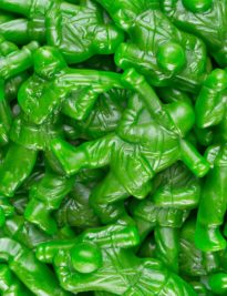 Green gummy army men in a bunch
