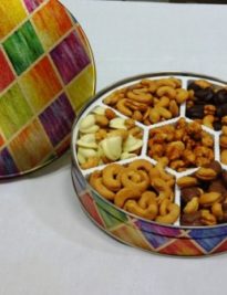 gift tin filled with chocolate covered, roasted and butter toffee cashews